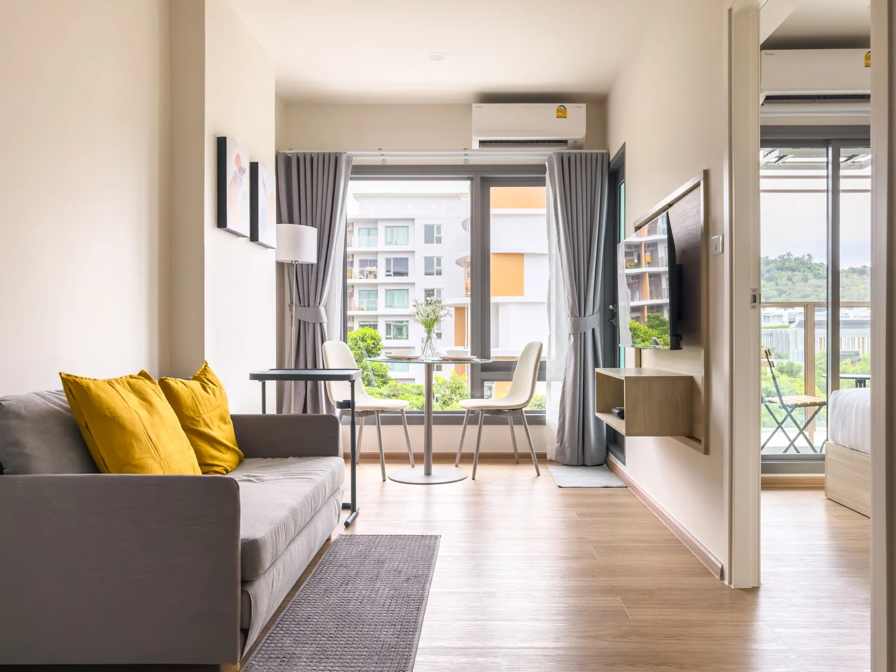 Bright living room with sofa and large windows