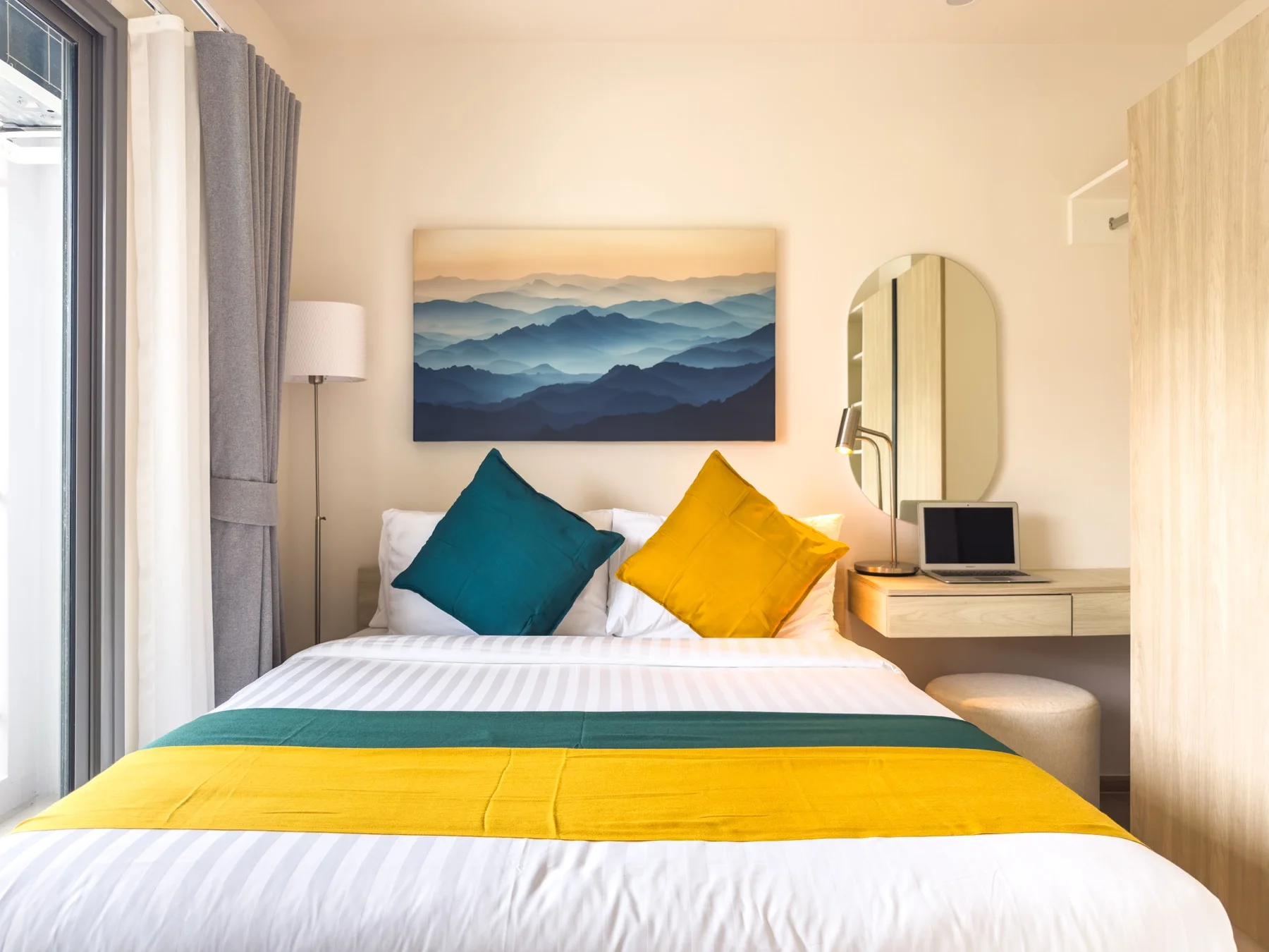 Queen bedroom with warm bedside lighting
